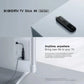 Xiaomi TV Stick 4K 2ᵉ gen branché en HDMI derrière un téléviseur